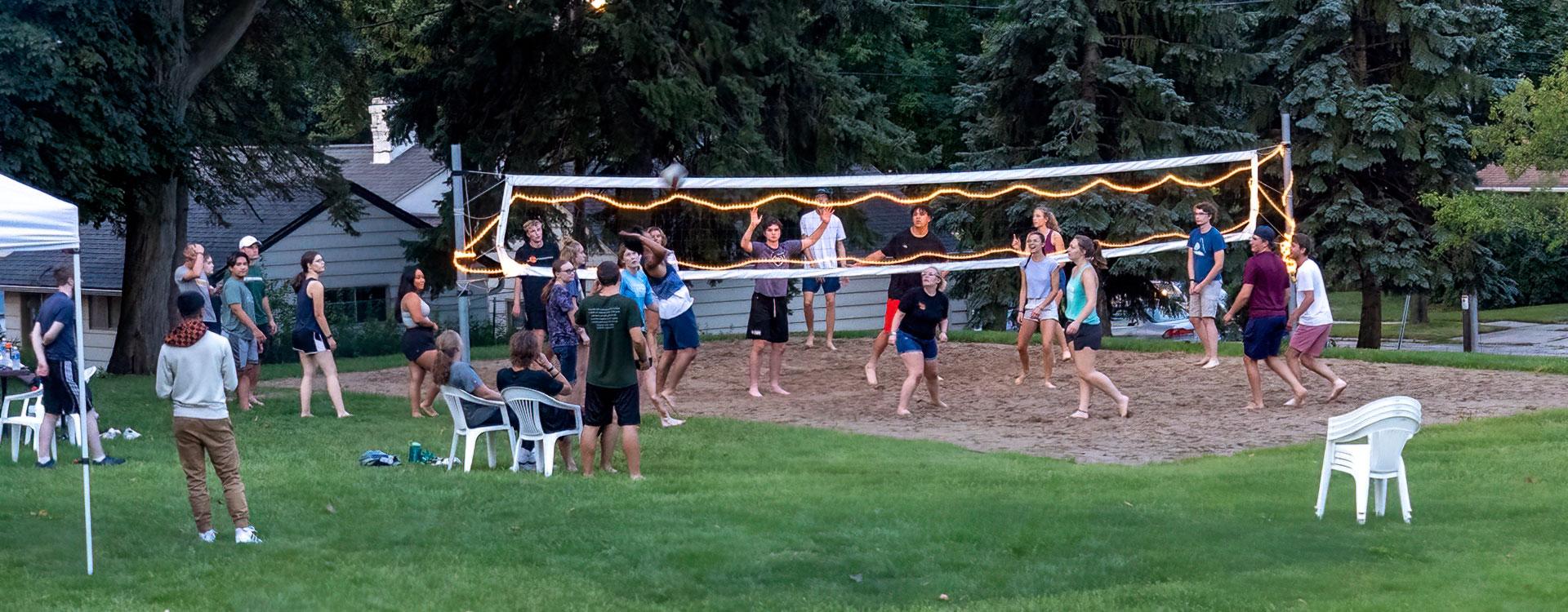 Students playing sand volleyball on WLC campus